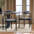 Chaises de salle à manger en fer forgé et tissu (deux chaises par lot).