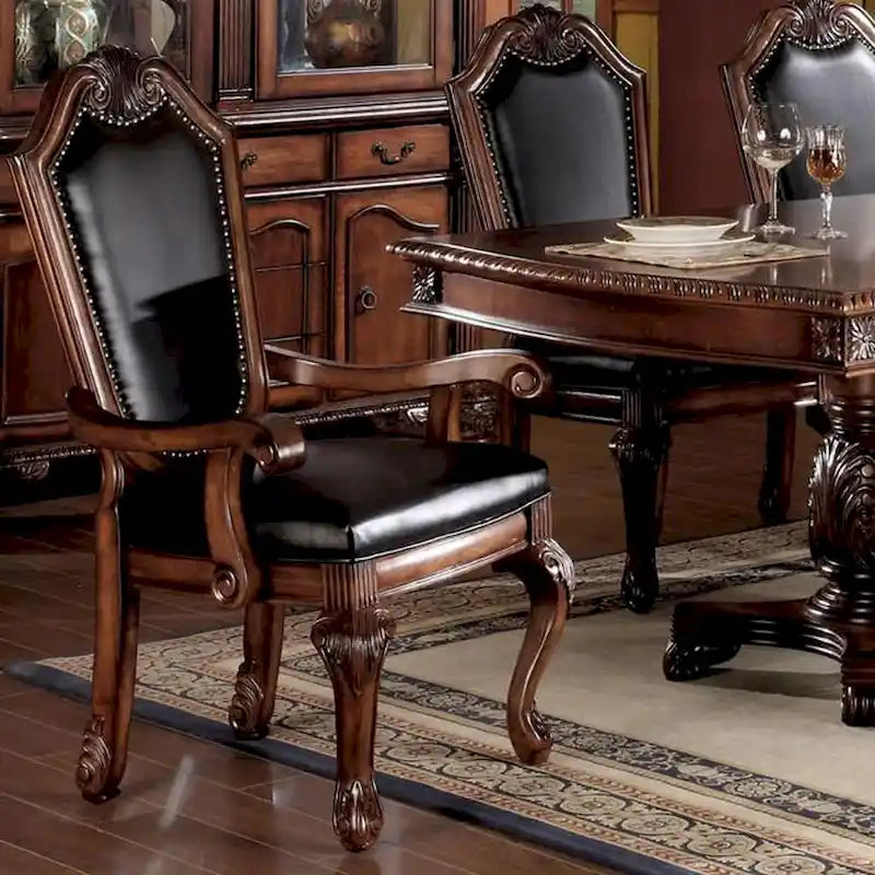 Fauteuils (lot de deux), en polyuréthane noir et bois de cerisier.